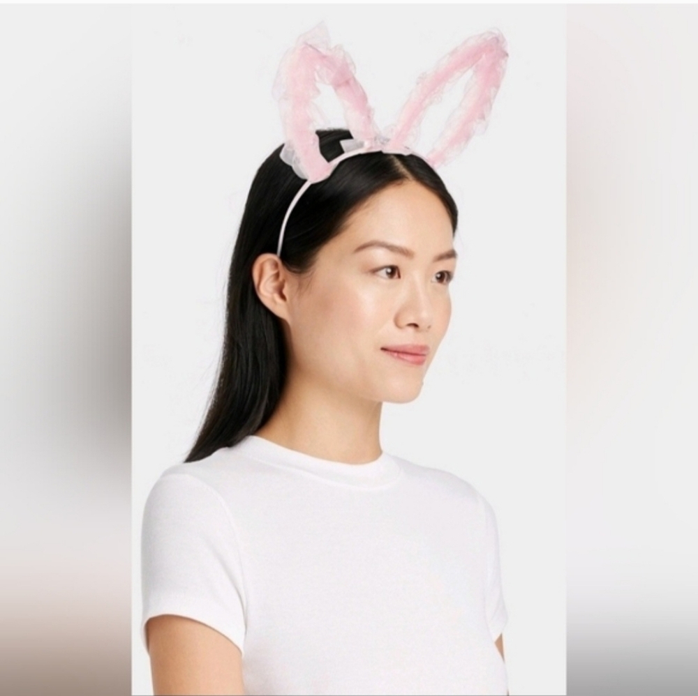 Adorable pink bunny ear headband with ruffled fabric and pearl accents. Easter